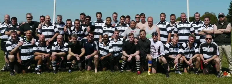 The Lion Kings lined up across the pitch in black and white hooped jerseys