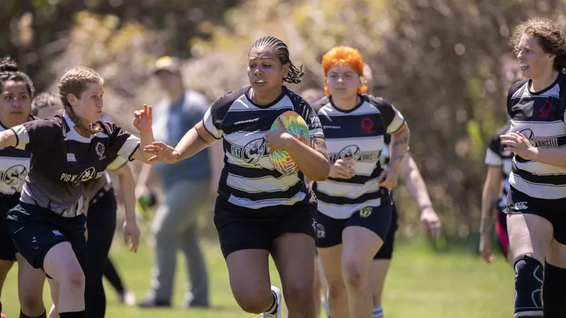 Women's+ Lions players charge upfield in support of the ball carrier